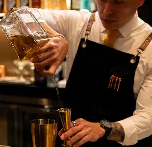 CISCo Bartender Pouring Whiskey
