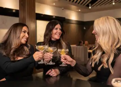 3 women toasting while having dinner at CISCo Restaurant + Bar in Corona, CA