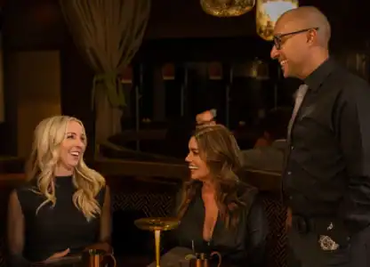 Owner of CISCo Restaurant + Bar having a lighthearted conversation with diners
